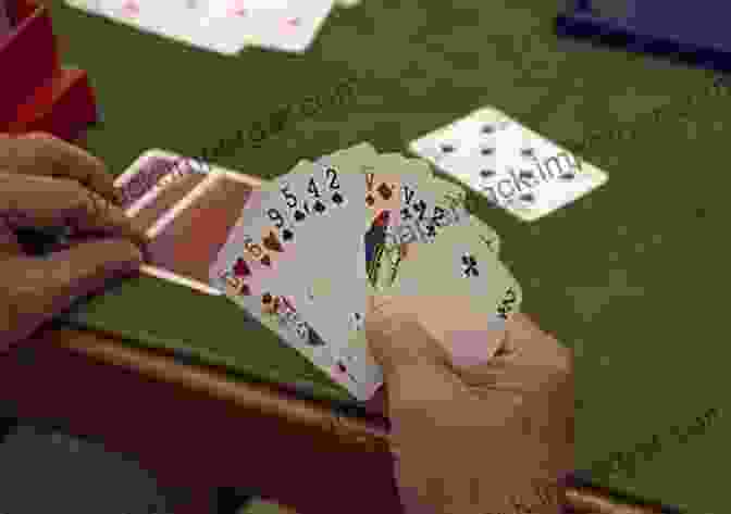 A Bridge Player Holding A Hand Of Cards Bidding Accurately In Bridge