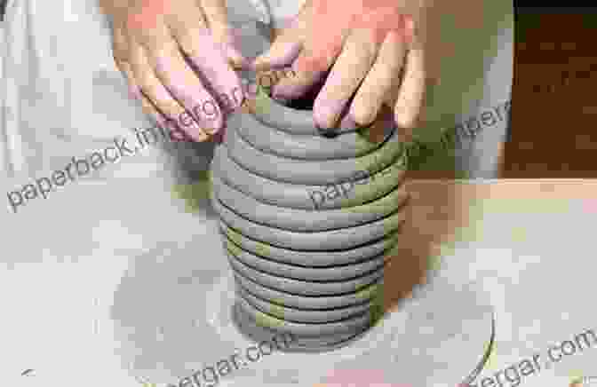 A Potter Skillfully Coiling Clay To Create A Vessel BASIC PRACTICAL GUIDE TO POTTERY COILING: Every Step By Step Guide To Get Beginners Started In Pottery Coiling