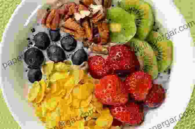 A Vibrant And Colorful Vegan Breakfast Bowl Filled With Fruits, Nuts, And Granola. Vegan Diet: Cookbook